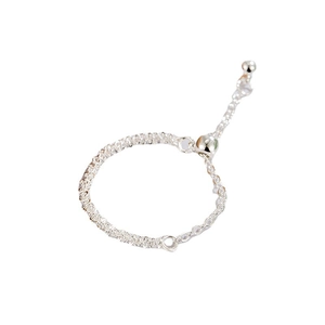 Adjustable silver chain ring with a sliding bead closure and sparkling textured finish