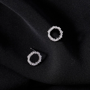 Detailed view of 925 sterling silver hoop earrings with pavé cubic zirconia setting