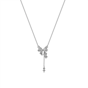 Silver bow necklace with zircon tassel and star pendant for a minimalist elegant style