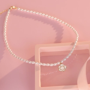 S925 silver camellia pearl necklace with white flower pendant and gold accents