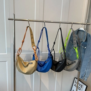 Nylon crossbody bags in khaki, navy, black and grey with woven shoulder straps