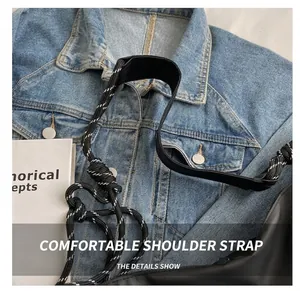 Detail of the woven rope strap and padded shoulder protector on a casual crossbody bag