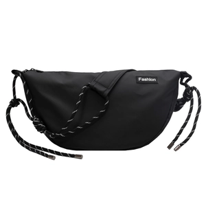 Detail of black half-moon crossbody bag with striped braided rope and fashion label