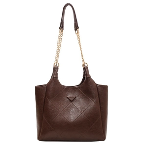 Retro dark brown quilted tote bag with chain strap and metal fashion tag on white background
