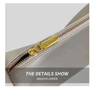 Detail of premium beige leather texture and gold-tone C&HEKA engraved zipper slider