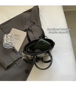 Interior view of stylish bucket bag showing large capacity for phone and cosmetics