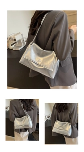 Detail of silver metallic wrinkled texture shoulder bag with chain strap and flap closure