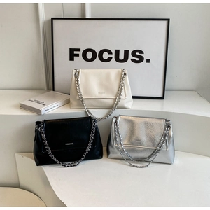 Chic ruched leather underarm bags in cream, black, and silver with metal chain straps