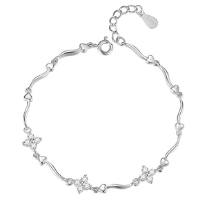 Sparkling S925 silver bracelet with heart links and crystal flower charms on white background