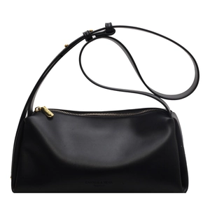 Minimalist black leather shoulder bag with adjustable strap and zipper closure