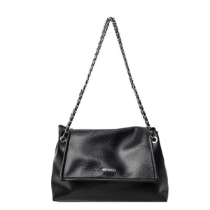 Close-up of black wrinkled leather shoulder bag with WEGOCO logo and silver chain strap
