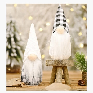 Close-up of Nordic Christmas gnomes with plaid fabric and long plush beard decor