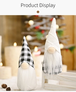 Detail view of plush Christmas gnomes with black-white plaid hats and white faux fur beards