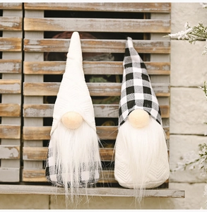 Detail of Christmas gnomes with black and white plaid hats and long white beards