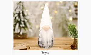 Front detail of a Christmas gnome figurine with black and white plaid fabric and knit hat