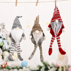 Detail of Christmas gnomes ornaments with knitted hats and long beards on a tree