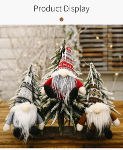 Detailed view of three knitted Christmas gnomes with long white beards and festive hats