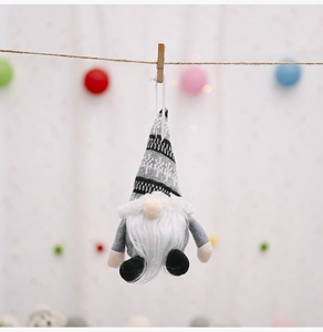 Close-up of a Nordic Christmas gnome hanging with gray knit hat and white fuzzy beard
