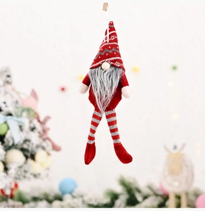 Close-up of hanging Christmas gnome featuring red striped legs and grey bushy beard