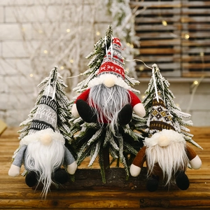Three Nordic Christmas gnome ornaments with knitted hats and plush beards for tree decor