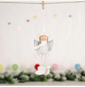 Detail of Christmas angel hanging ornament with plush wings and knitted hat on a string
