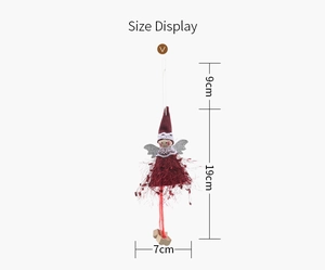 Size display of a plush Christmas angel ornament with red feathers and silver wings