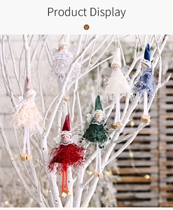 Detail of hanging plush Christmas angel dolls in six colors on white branches
