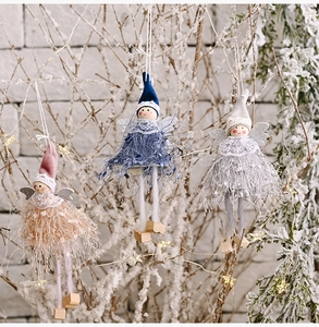 Detailed trio of plush angel dolls in pink, blue, and gray on festive branches