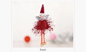 Detail of plush Christmas angel ornament with red velvet hat and silver glitter wings