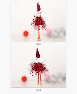 Detail view of plush Christmas elf ornament showing side and back angles in deep red