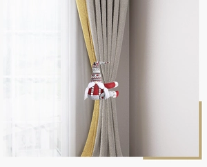 Detail of Christmas gonk curtain tieback with striped hat and white beard on window