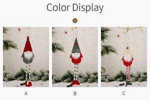Detailed view of three hanging Christmas gnomes with striped legs and wooden clips