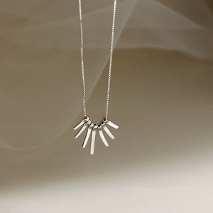 Minimalist silver fringe necklace with geometric fan-shaped pendant on thin box chain