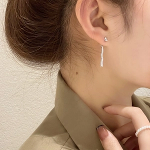 Irregular silver wave earrings featuring minimalist geometric lava liquid metal drop design