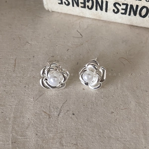French camellia pearl earrings with layered silver petals and central pearl charm
