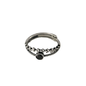 Detailed view of vintage silver double-layer wheat ring with a central black zircon gemstone