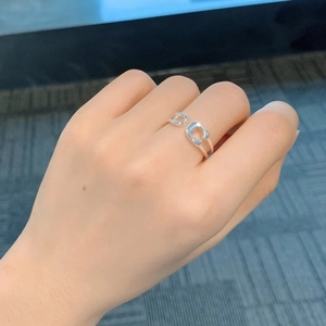 Minimalist silver open ring with hollow C-shape double line design on finger