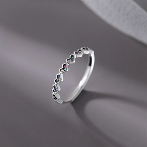 Rainbow gemstone sterling silver ring featuring colorful zircon stones in a sleek geometric band