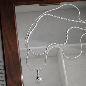 Elegant double layered silver waterdrop and rice bead necklace on a premium gift box