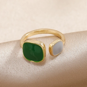 Adjustable gold open ring with asymmetrical green and white enamel square accents