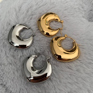 Minimalist thick teardrop heart earrings in polished gold and silver metal finishes