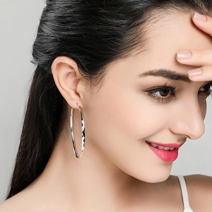 Polished S925 silver oversized hoop earrings with geometric diamond-cut pattern detail