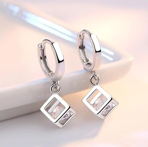 Minimalist square zircon hoop earrings in silver featuring a hollow sugar cube pendant