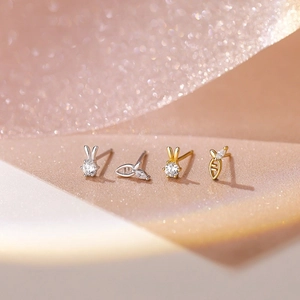 Asymmetric S925 silver rabbit and carrot earrings set with sparkling zircon stones