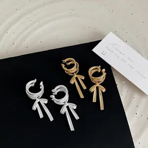 Matte gold and silver ballet-style ribbon bow ear cuffs for women without piercings