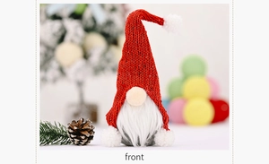 Detailed view of Christmas gnome with red sequined hat and plush white fur beard