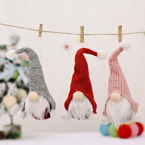 Three sequined Christmas gnome hangers in red, grey, and pink for festive tree decoration