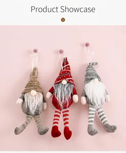 Detailed view of three knitted Christmas gnomes with long legs and plush beards for decor