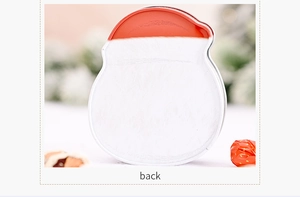 Back view of a Santa-shaped tin box with red and white metal finish for Christmas gifts