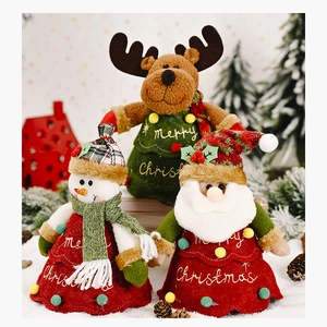 Detailed view of plush reindeer, snowman, and Santa figurines with Merry Christmas embroidery